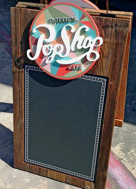 An image of Dottie's Pop Shop a-frame signage.